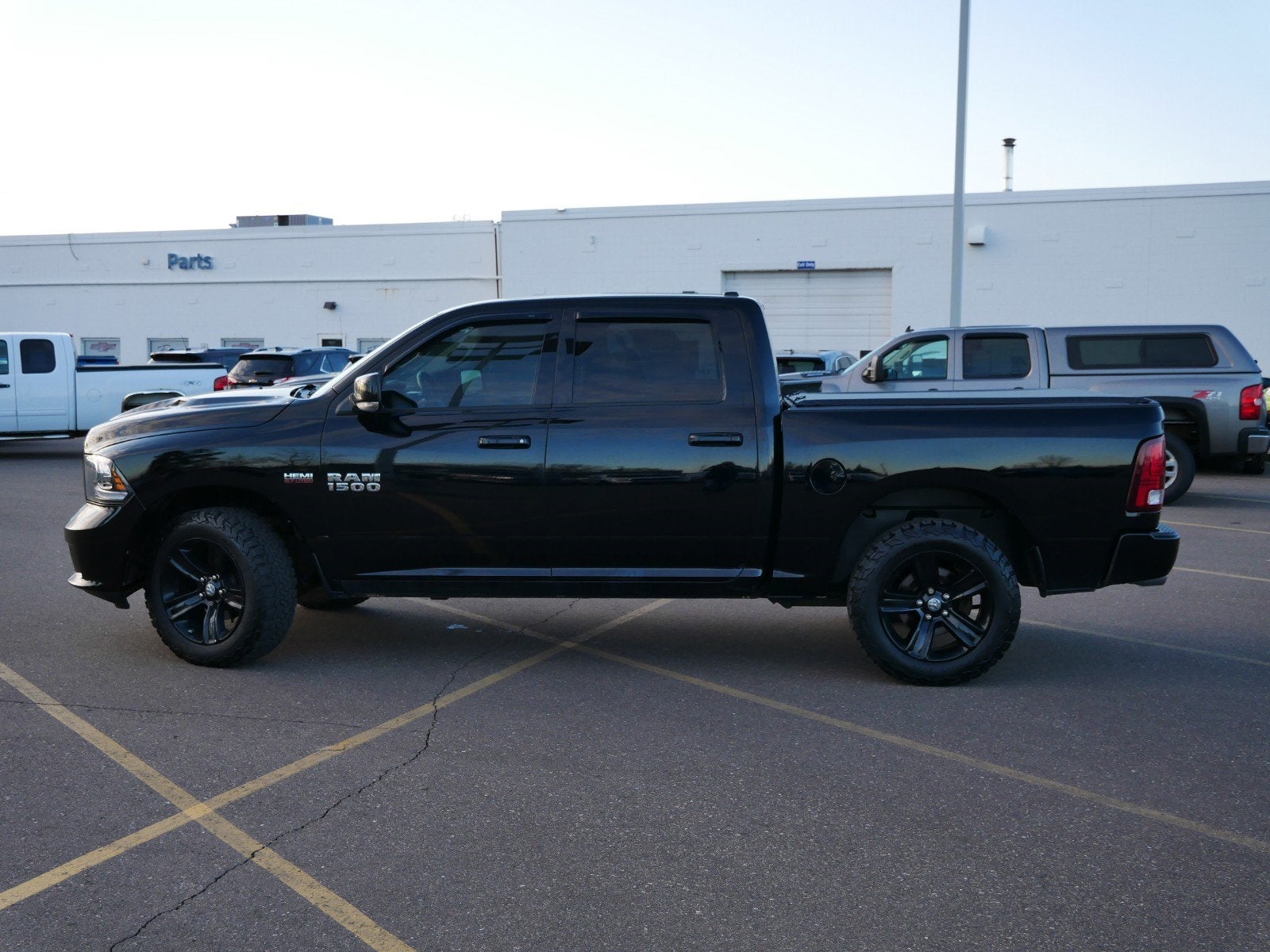 Used 2014 RAM Ram 1500 Sport with VIN 1C6RR7MT0ES155256 for sale in Fridley, Minnesota