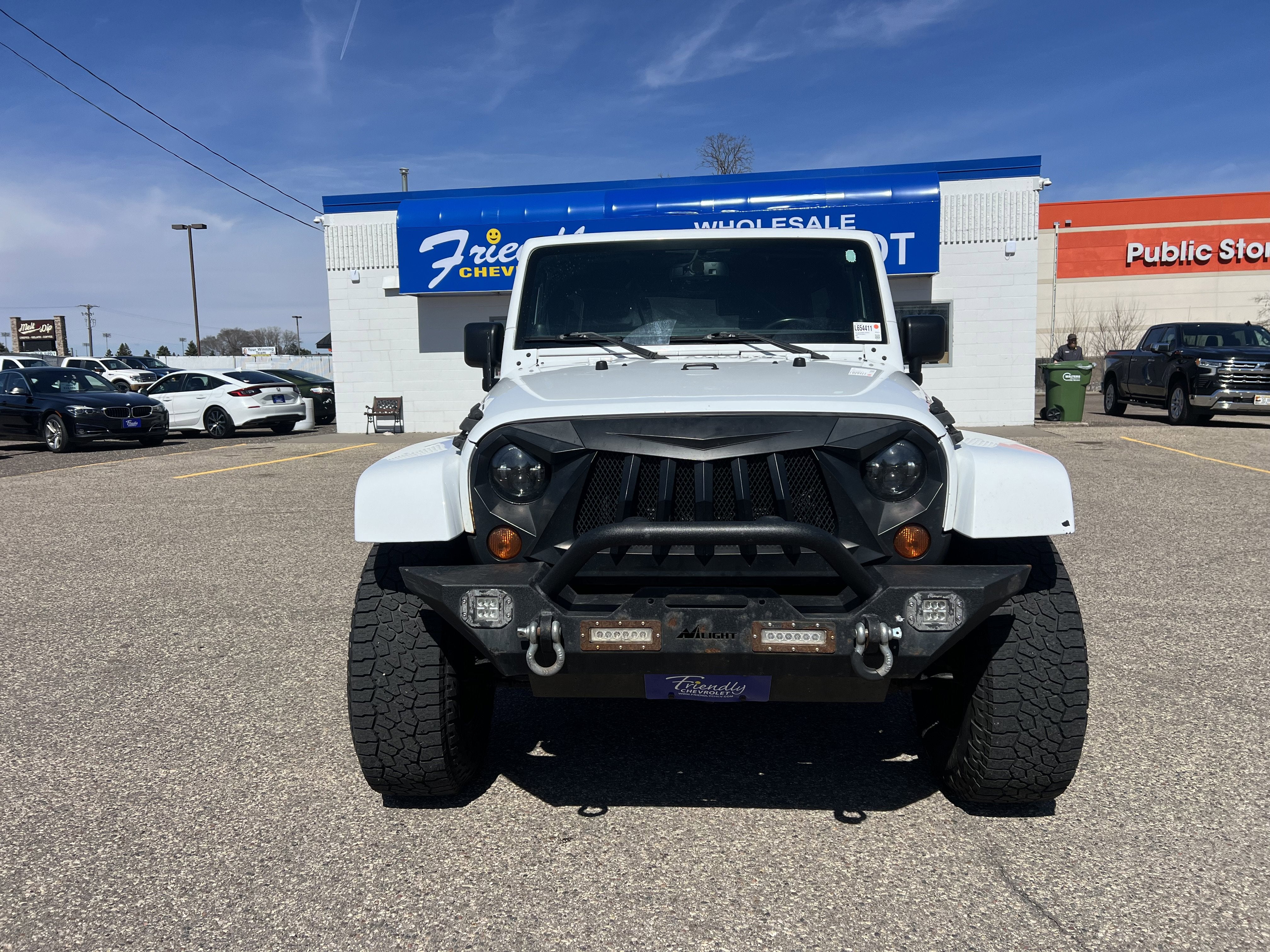 Used 2013 Jeep Wrangler Unlimited Sahara with VIN 1C4BJWEG8DL654411 for sale in Fridley, Minnesota