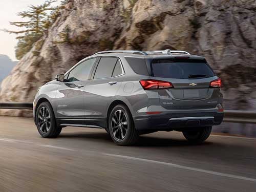 2023 Chevrolet Equinox driving down a road
