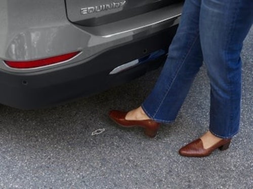 2024 Chevrolet Equinox close up view of usage of hands-free power liftgate