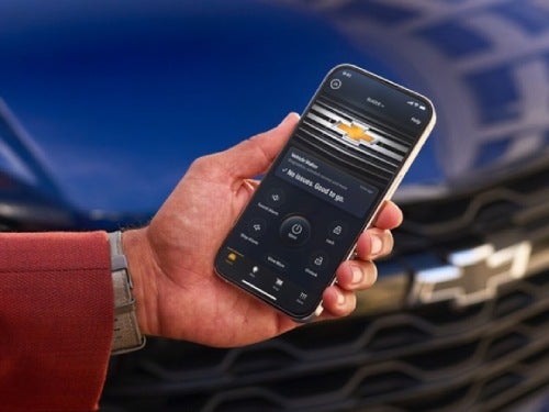 2024 Chevrolet Malibu close up view of phone with myChevrolet mobile app pulled up