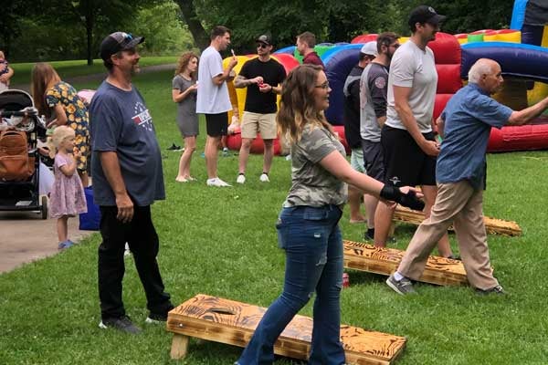 Friendly Chevrolet team members playing cornhole