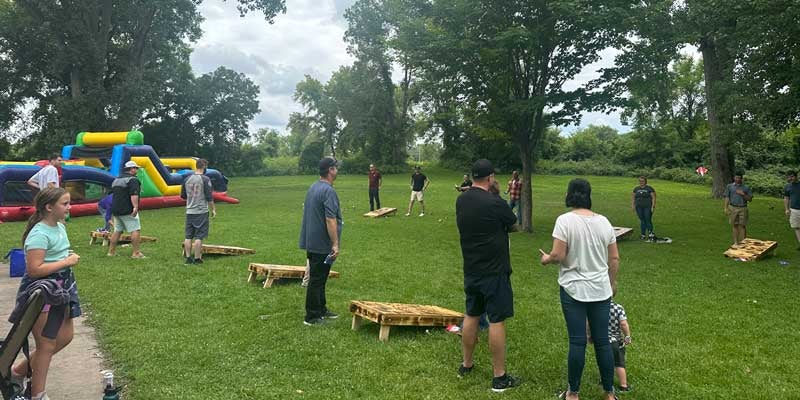 Friendly Chevrolet team members playing cornhole